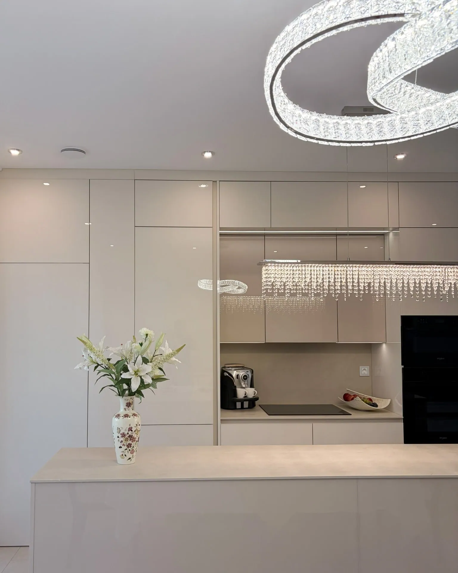 Crystal chandelier above the island