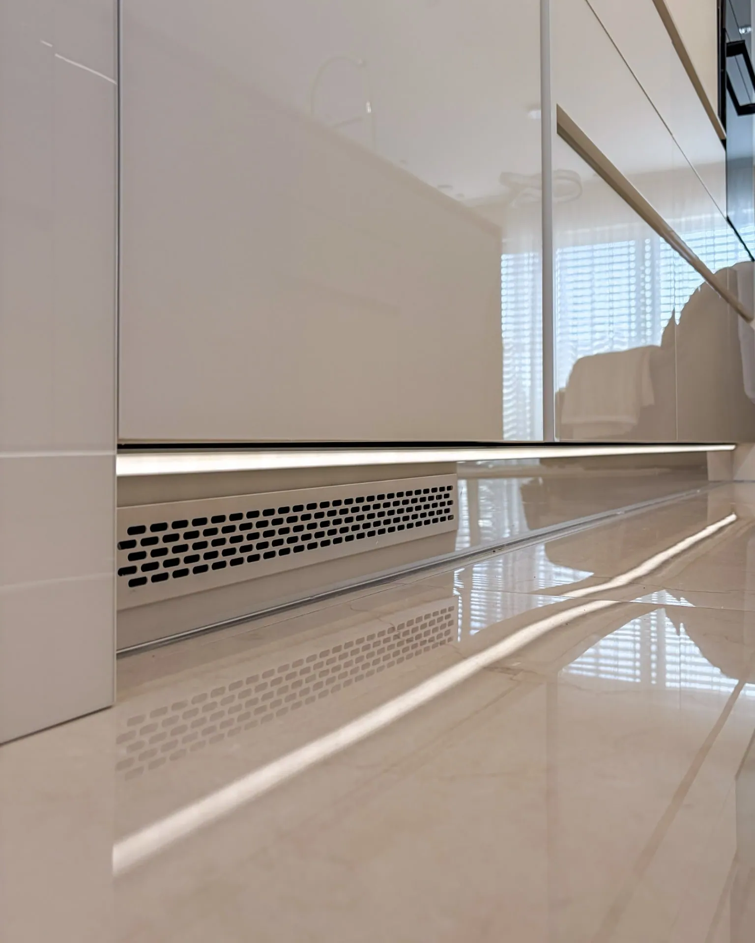 Detail: integrated lighting in the tall cabinet run