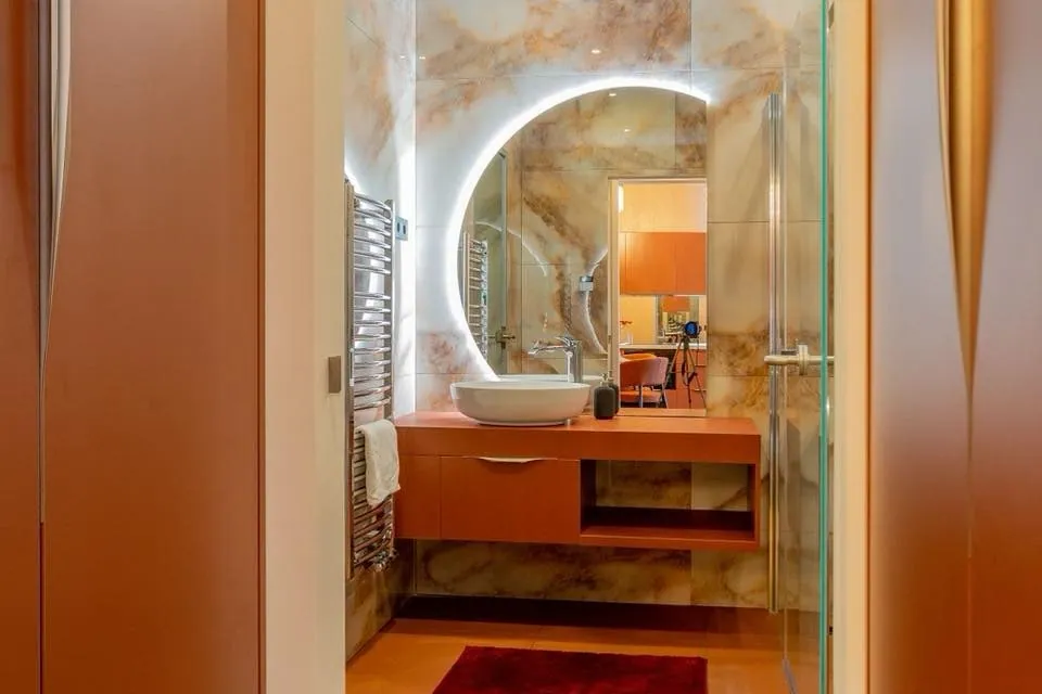 Bathroom with an illuminated mirror