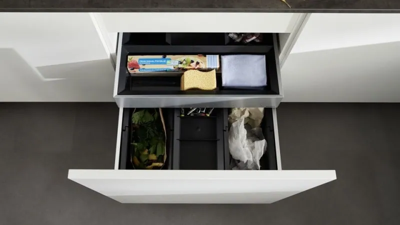 Pull-out recycling bin in a drawer